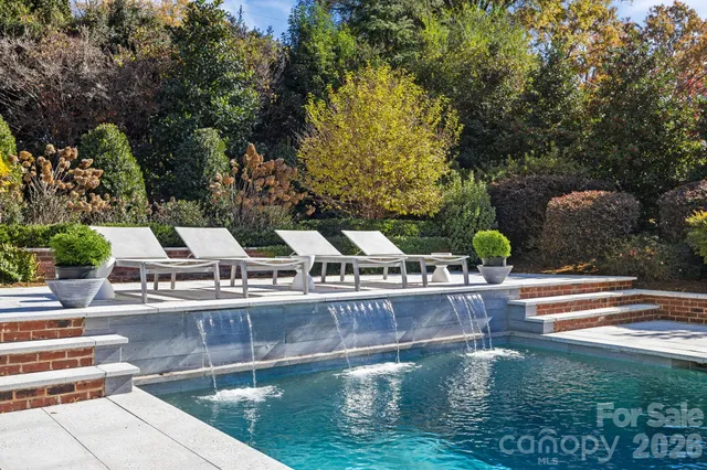 a view of a house with backyard porch and garden