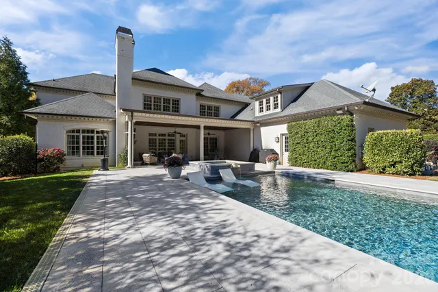 a view of swimming pool with a yard