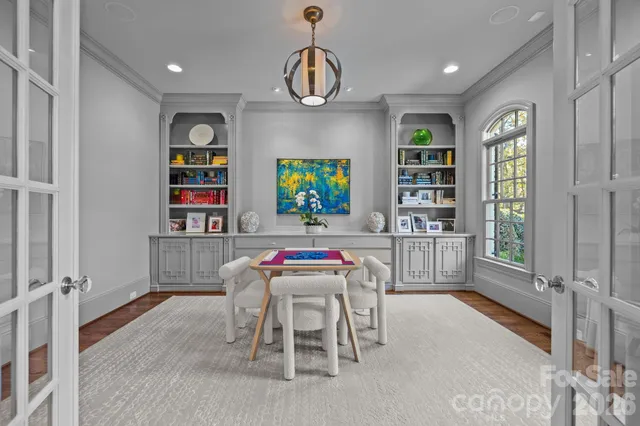 a dining room with furniture and window