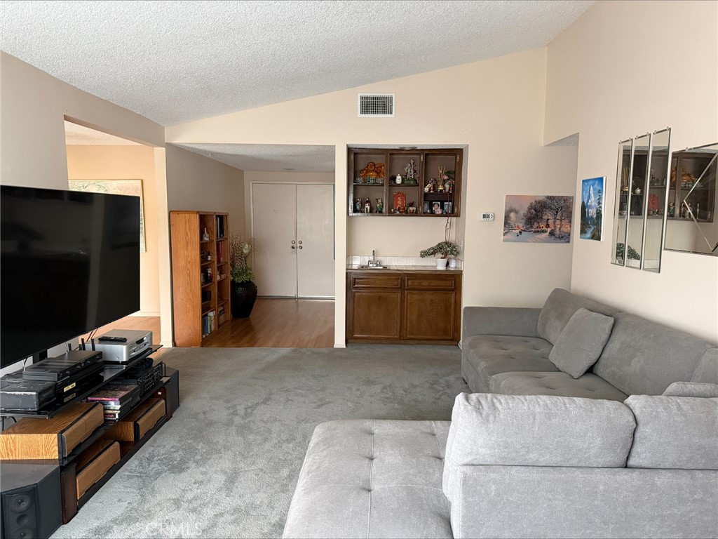 1114 Bottle Tree Way Hemet, CA 92545 - Photo 4 of 23 a living room with furniture and a flat screen tv