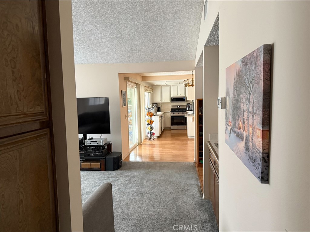 1114 Bottle Tree Way Hemet, CA 92545 - Photo 5 of 23 a view of a living room with furniture and a flat screen tv