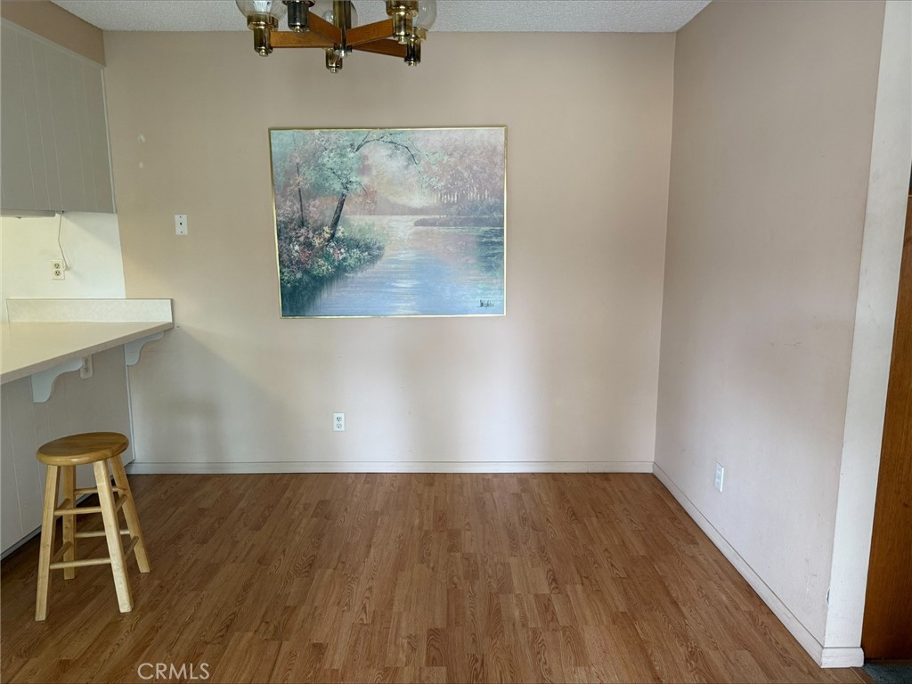 1114 Bottle Tree Way Hemet, CA 92545 - Photo 6 of 23 a view of room with wooden floor and lounge chair