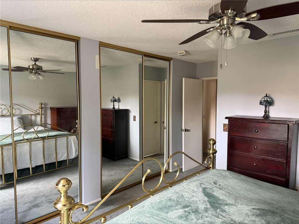 1114 Bottle Tree Way Hemet, CA 92545 - Photo 10 of 23 a bedroom with a bed and a dresser