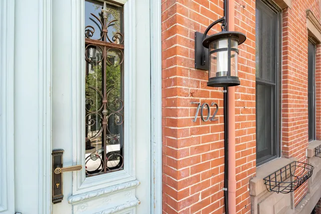 a front view of a house with a door and a window