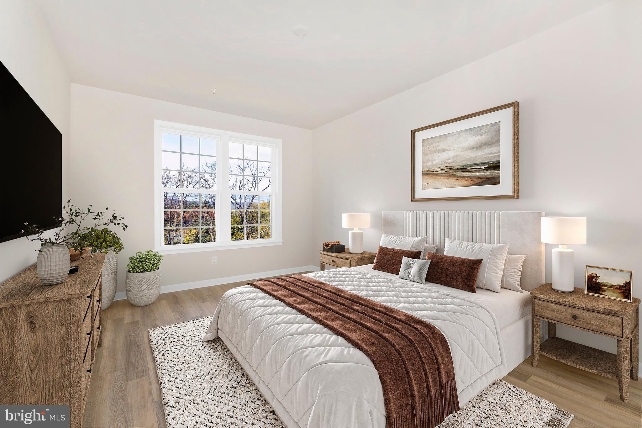 103 Spring Bank Way Frederick, MD 21701 - Photo 11 of 13 a bedroom with a bed and a flat screen tv