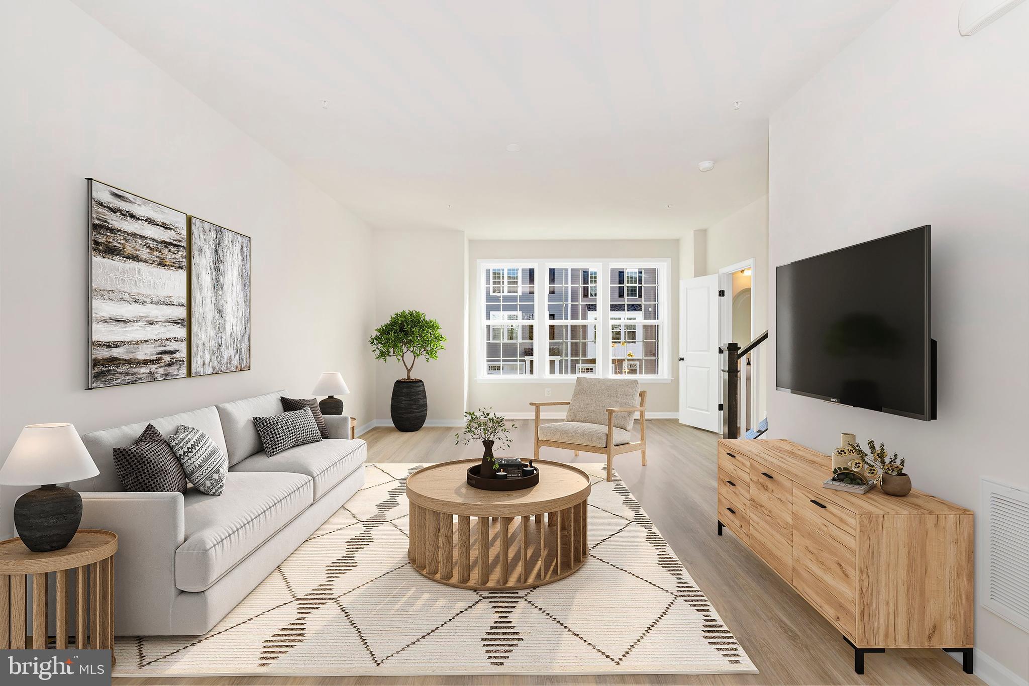 103 Spring Bank Way Frederick, MD 21701 - Photo 10 of 13 a living room with furniture and a flat screen tv
