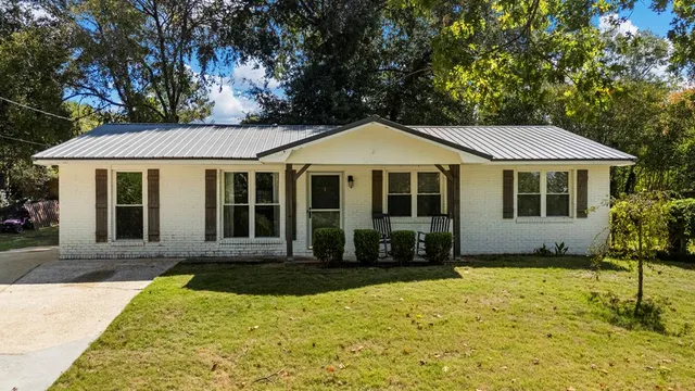 a front view of a house with yard
