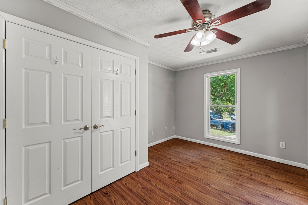 5422 Colony Drive Columbus, GA 31909 - Photo 12 of 32 wooden floor in an empty room with a window