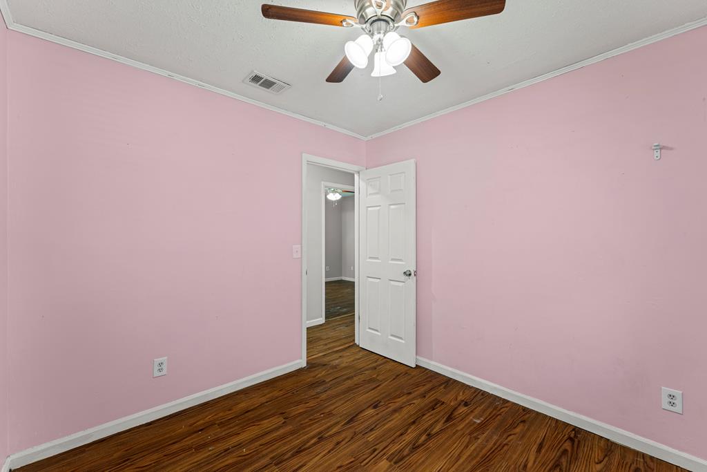 5422 Colony Drive Columbus, GA 31909 - Photo 16 of 32 a view of an empty room with wooden floor