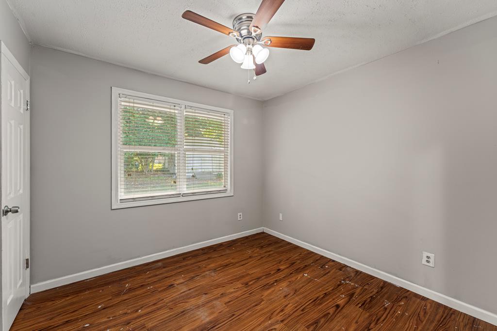 5422 Colony Drive Columbus, GA 31909 - Photo 18 of 32 wooden floor in an empty room with a window