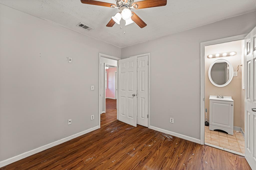 5422 Colony Drive Columbus, GA 31909 - Photo 19 of 32 a view of a room with window a ceiling fan and wooden floor