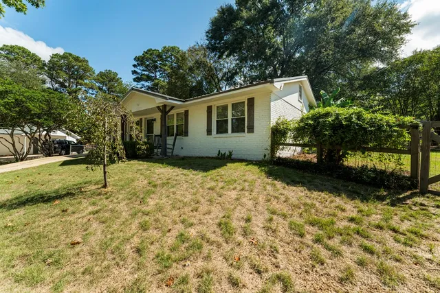 a house with trees in front of it