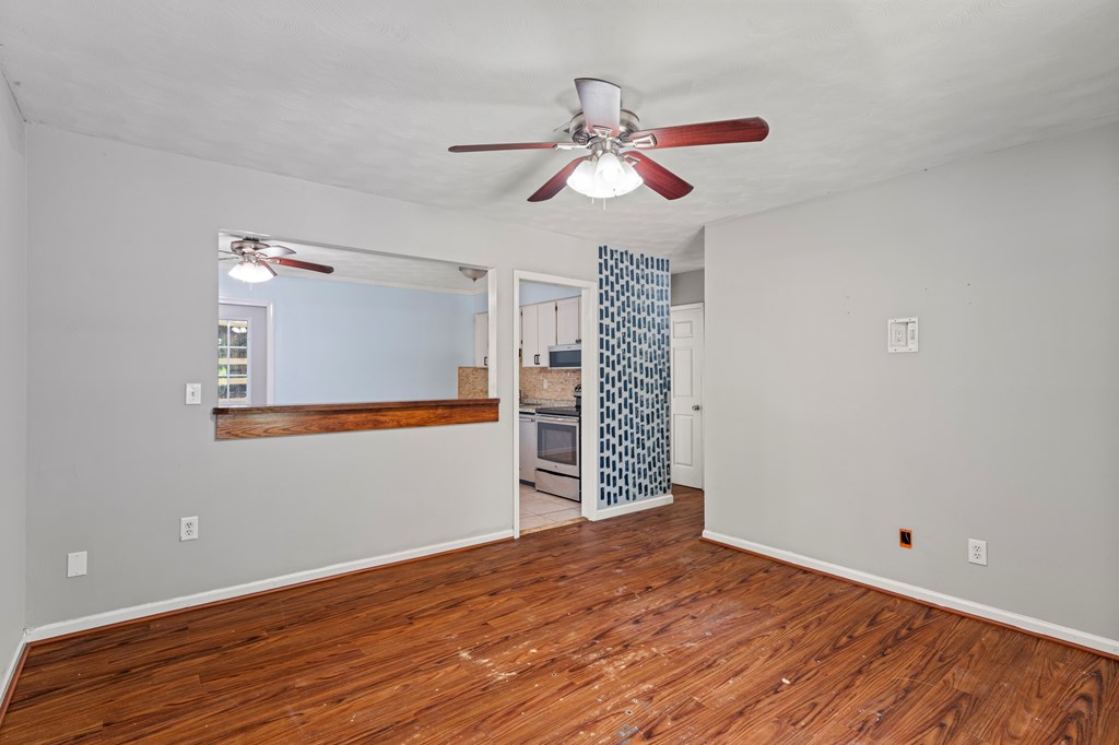 5422 Colony Drive Columbus, GA 31909 - Photo 4 of 32 a view of empty room with wooden floor and fan