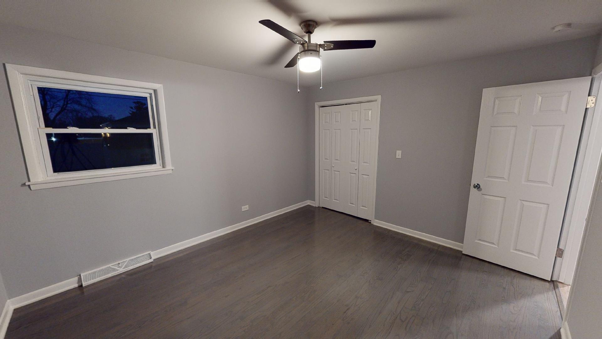 526 High Ridge Road Hillside, IL 60162 - Photo 13 of 19 an empty room with windows and fan