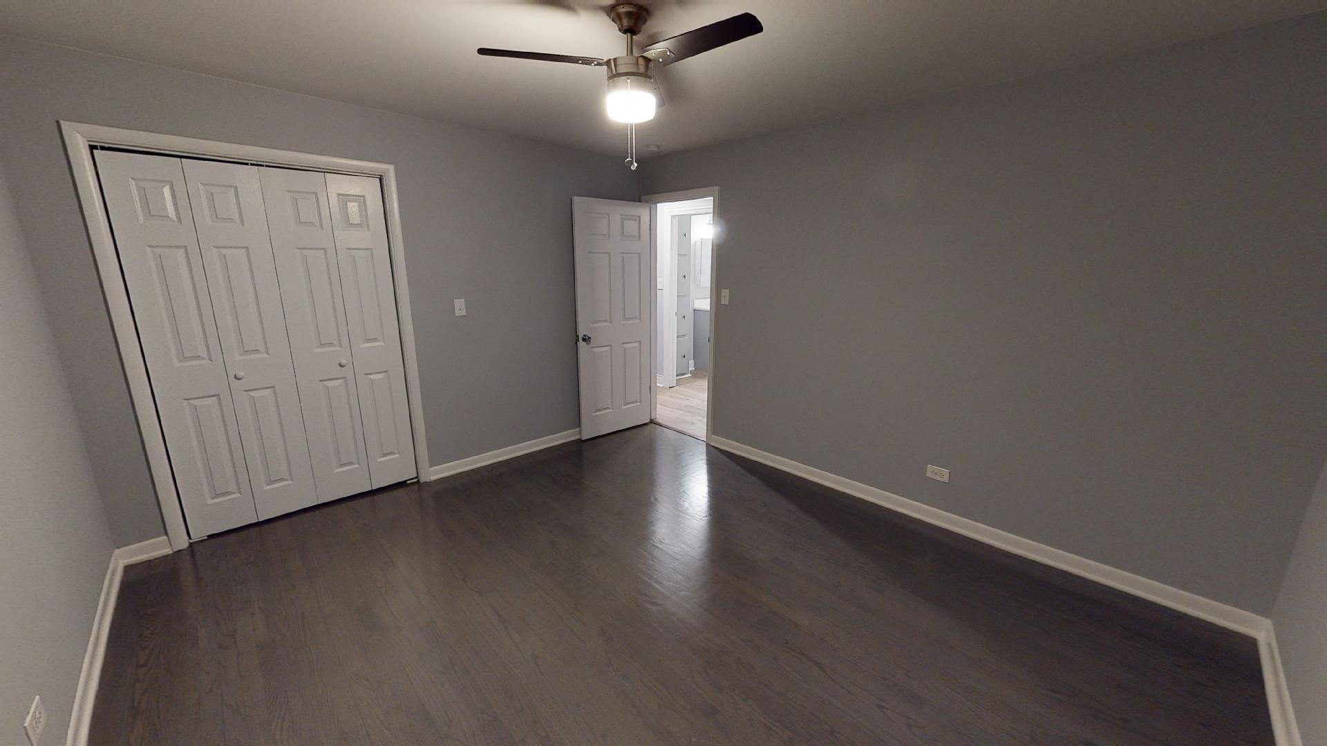 526 High Ridge Road Hillside, IL 60162 - Photo 14 of 19 an empty room with wooden floor and windows