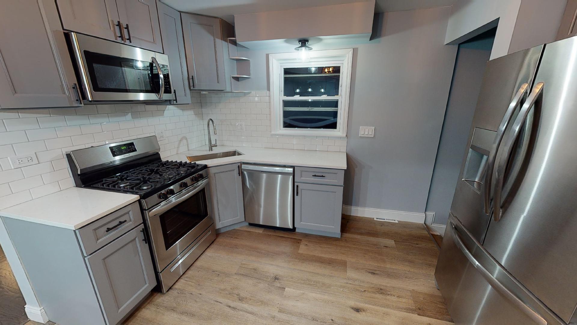 526 High Ridge Road Hillside, IL 60162 - Photo 4 of 19 a kitchen with stainless steel appliances a sink stove and microwave