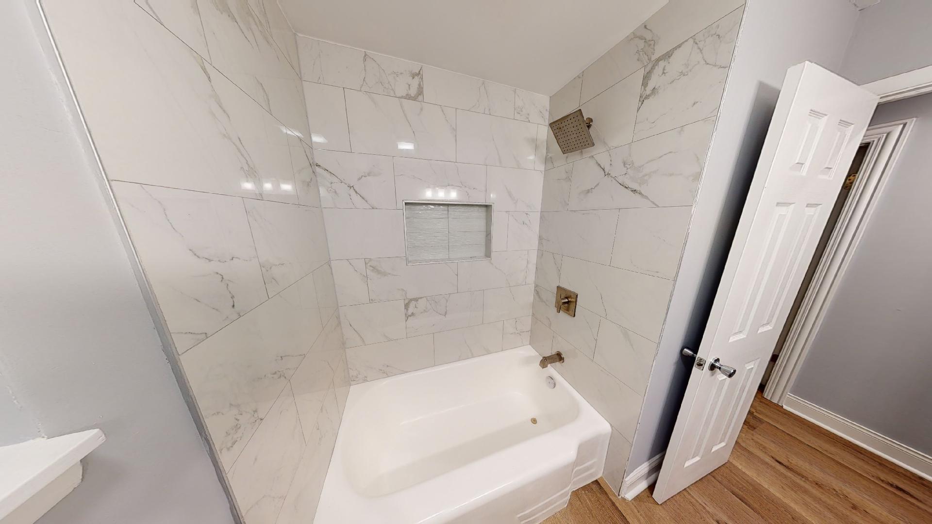 526 High Ridge Road Hillside, IL 60162 - Photo 10 of 19 a bathroom with shower and a tub