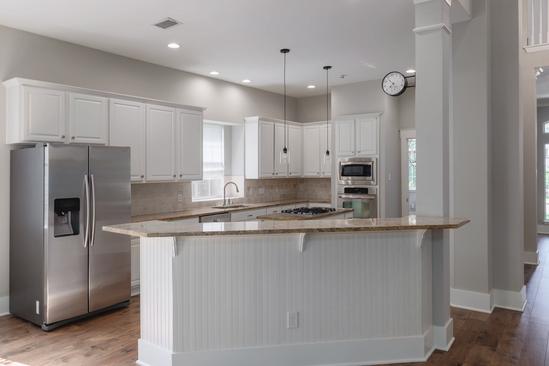 5512 Ballenton Lane Austin, TX 78739 - Photo 16 of 40 A well-appointed culinary space featuring extensive counter seating and built-in appliances for effortless entertaining.