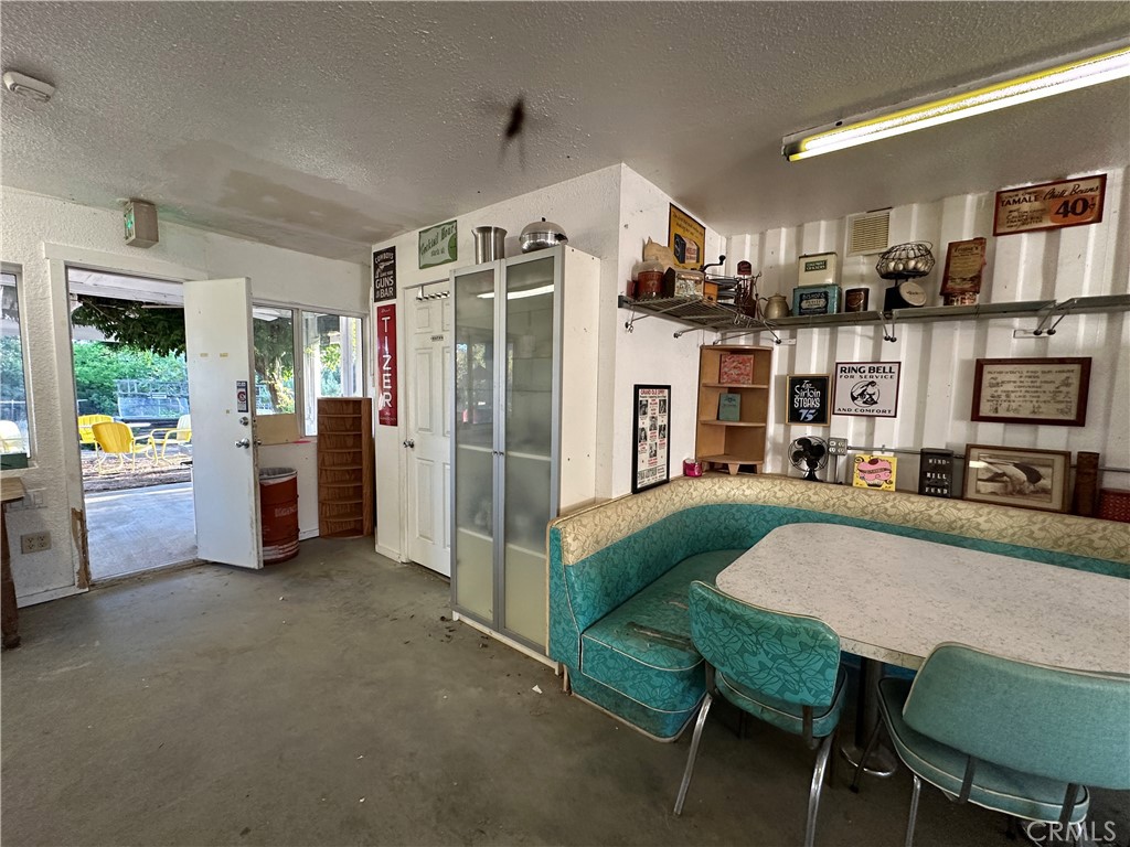 29820 Chihuahua Valley Road Warner Springs, CA 92086 - Photo 35 of 75 a view of a dining room with furniture window and wooden floor