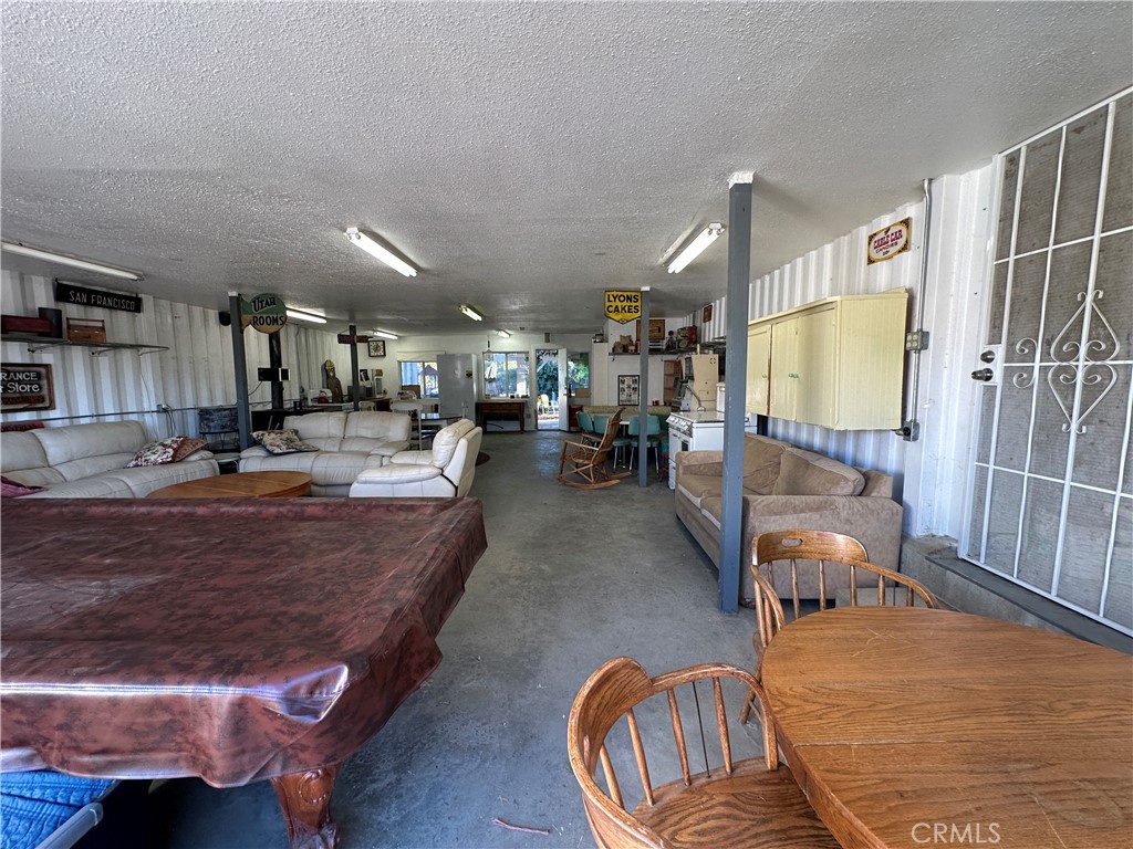 29820 Chihuahua Valley Road Warner Springs, CA 92086 - Photo 36 of 75 a living room with furniture and a flat screen tv