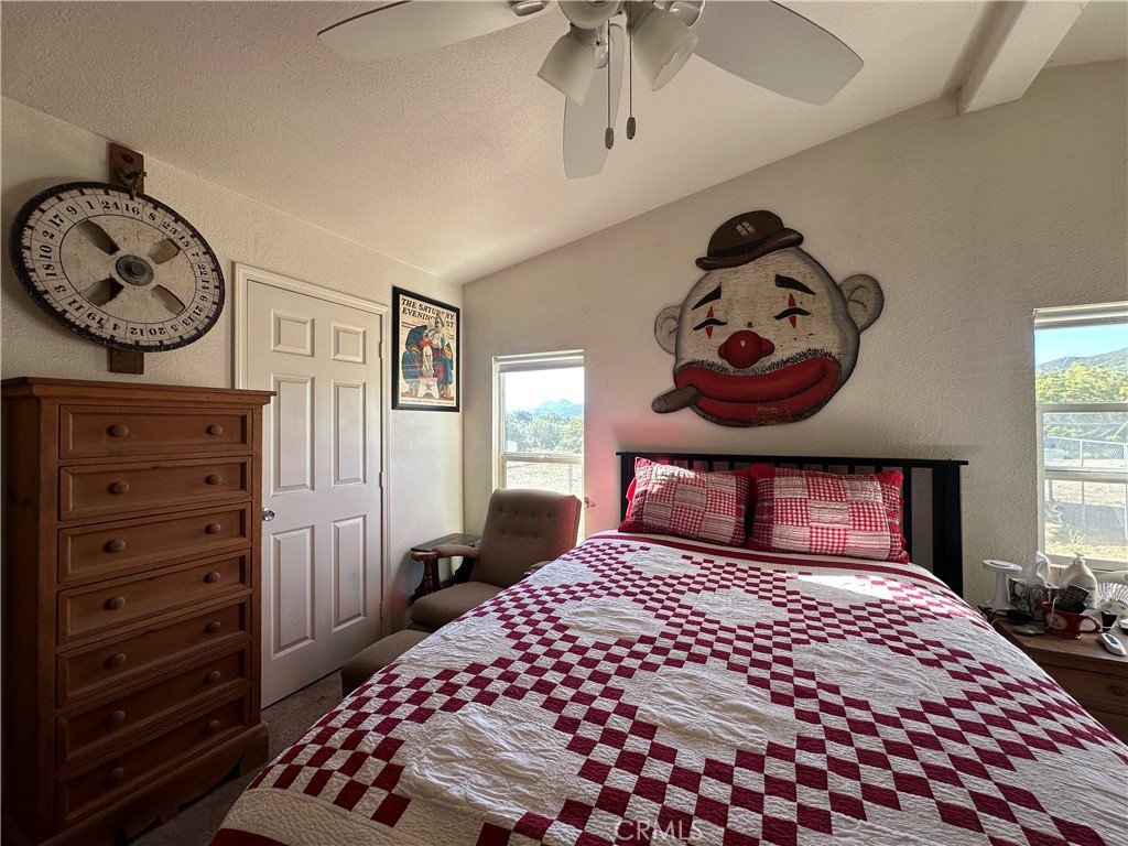 29820 Chihuahua Valley Road Warner Springs, CA 92086 - Photo 58 of 75 a bedroom with a bed and a chandelier