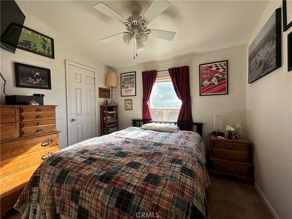 29820 Chihuahua Valley Road Warner Springs, CA 92086 - Photo 62 of 75 a bedroom with a bed and a flat screen tv