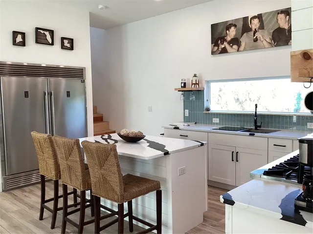 a kitchen with a sink cabinets and counter space