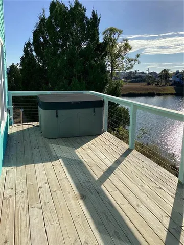 a view of a balcony with wooden floor