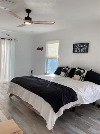a bedroom with a bed and window