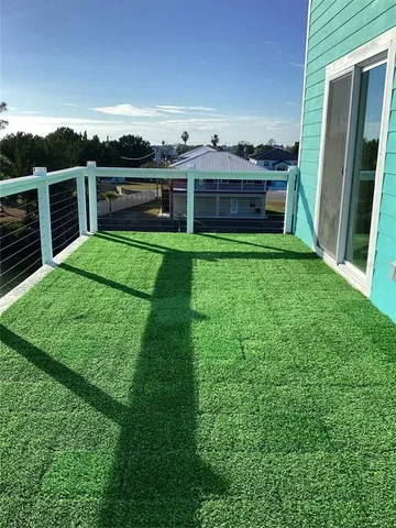a view of a backyard with seating area