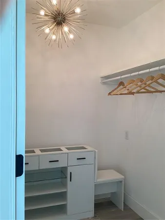 a view of a room with racks on the wall