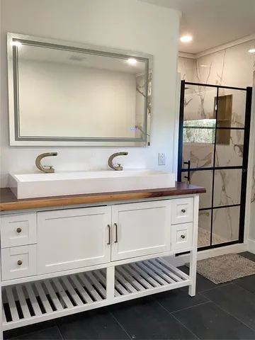 a bathroom with a sink and a mirror
