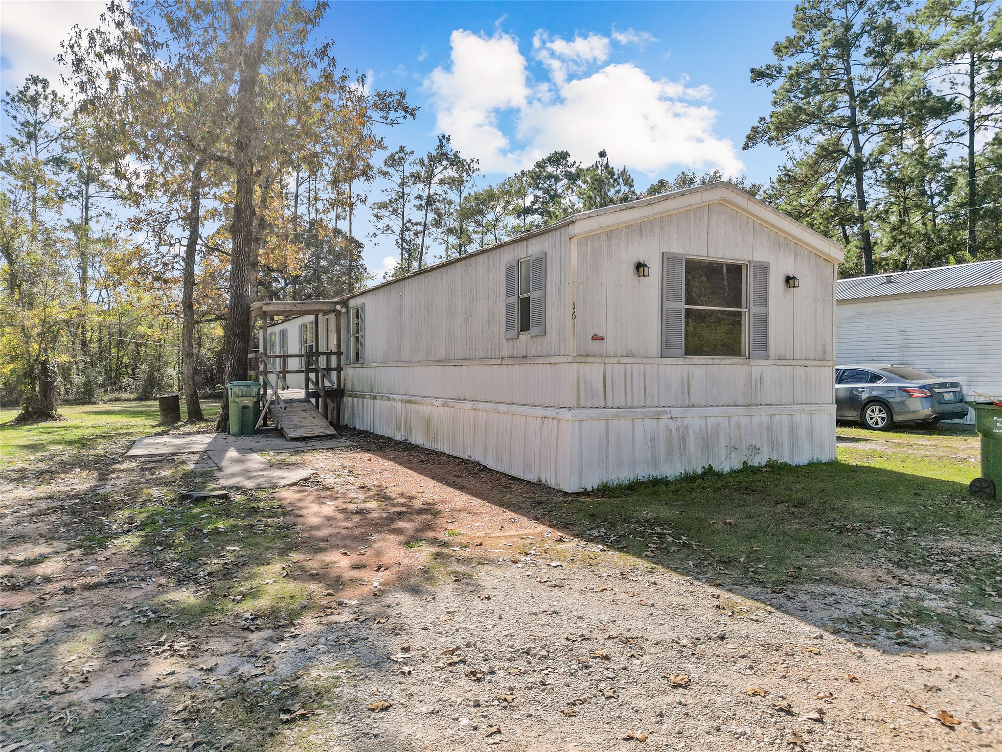 1202 Highway 190, Unit 16 Huntsville, TX 77340 - Photo 1 of 23 a view of a backyard of the house