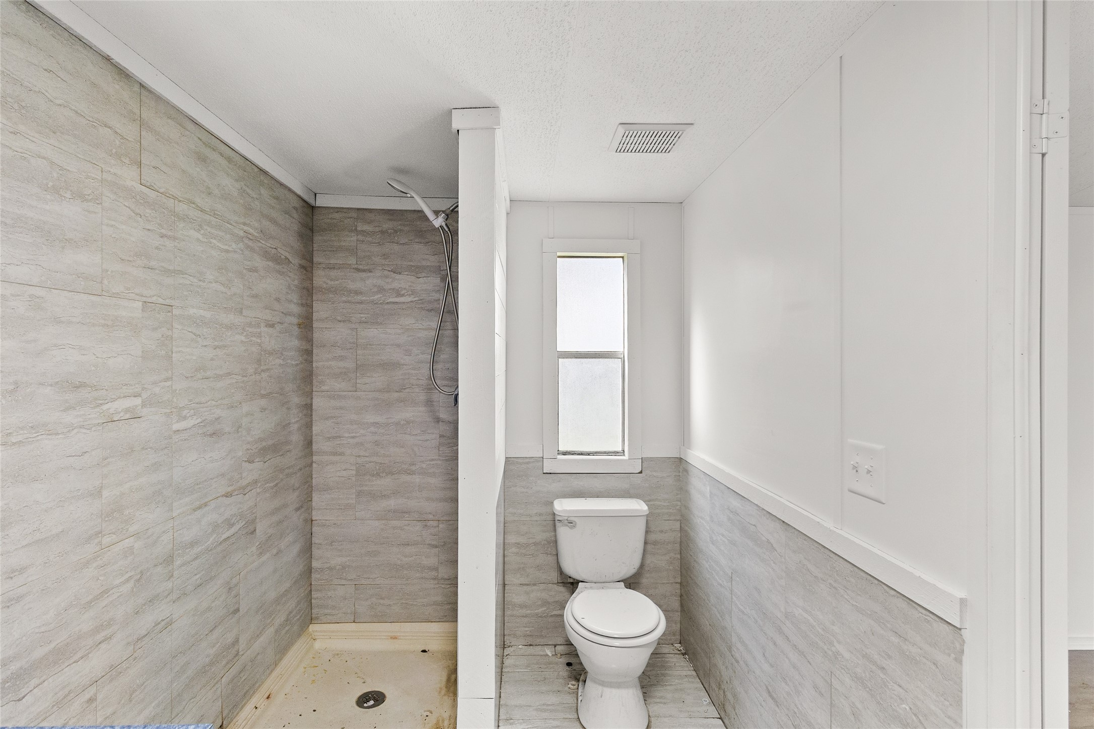 1202 Highway 190, Unit 16 Huntsville, TX 77340 - Photo 17 of 23 a bathroom with a toilet and a shower