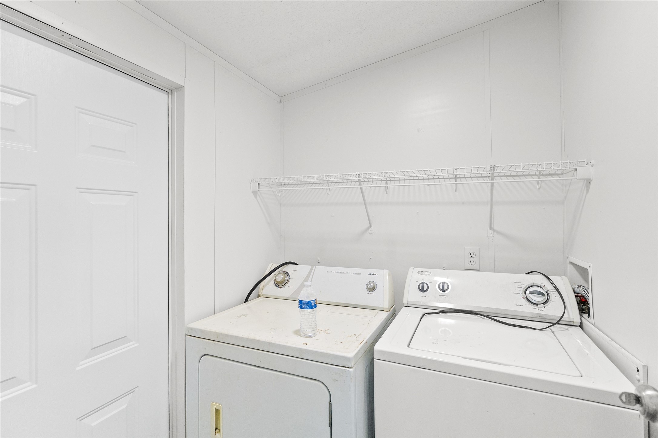 1202 Highway 190, Unit 16 Huntsville, TX 77340 - Photo 19 of 23 a utility room with dryer and washer