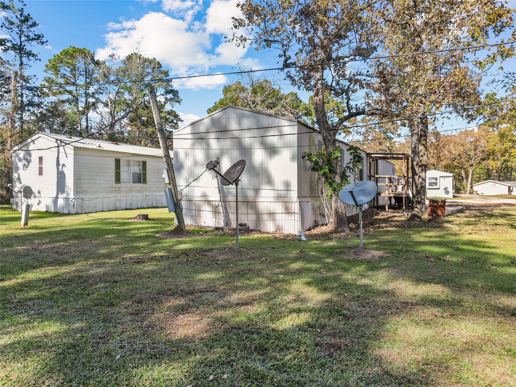 1202 Highway 190, Unit 16 Huntsville, TX 77340 - Photo 20 of 23 a backyard of apartments with large trees