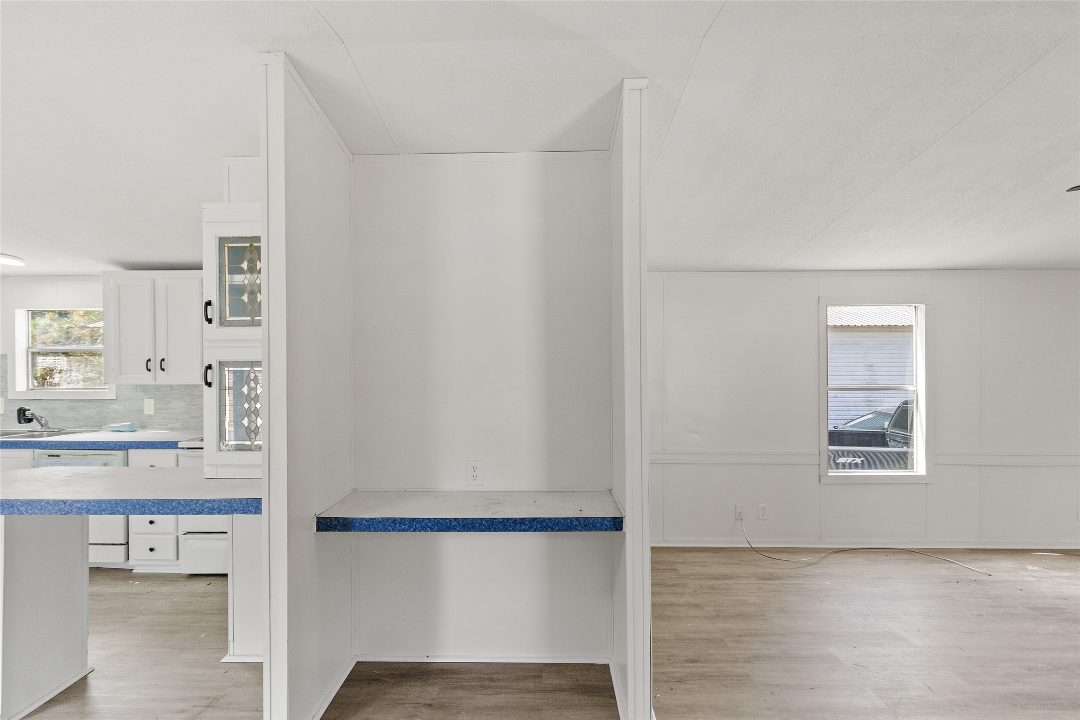 1202 Highway 190, Unit 16 Huntsville, TX 77340 - Photo 3 of 23 a view of kitchen with hallway and closet