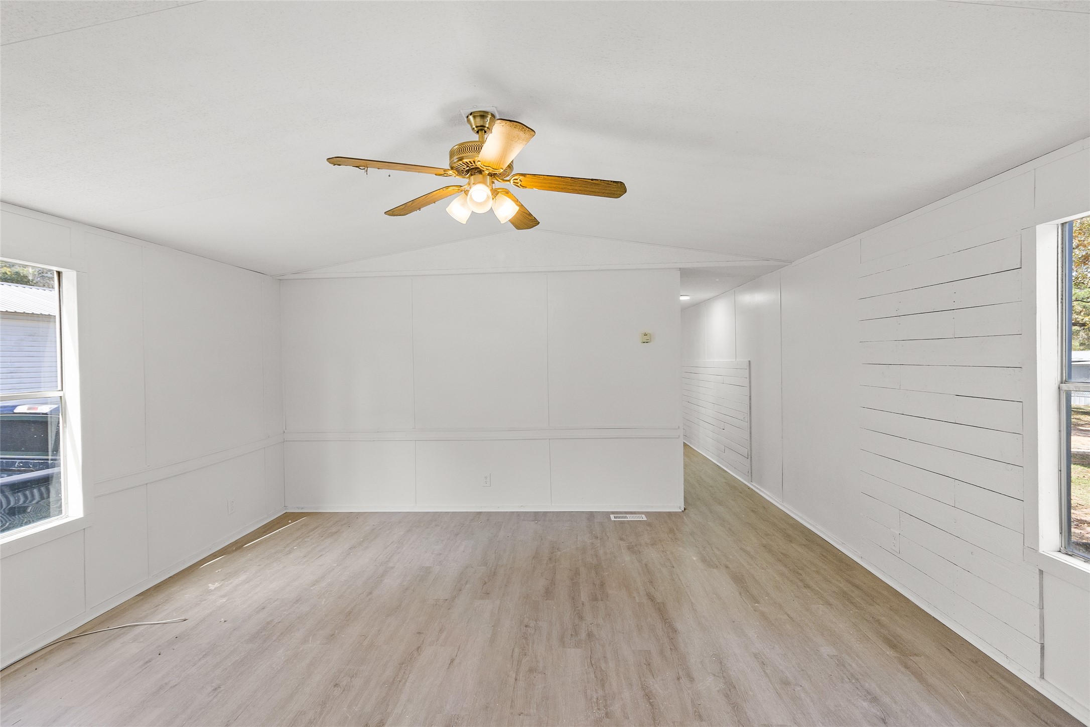 1202 Highway 190, Unit 16 Huntsville, TX 77340 - Photo 7 of 23 wooden floor in an empty room