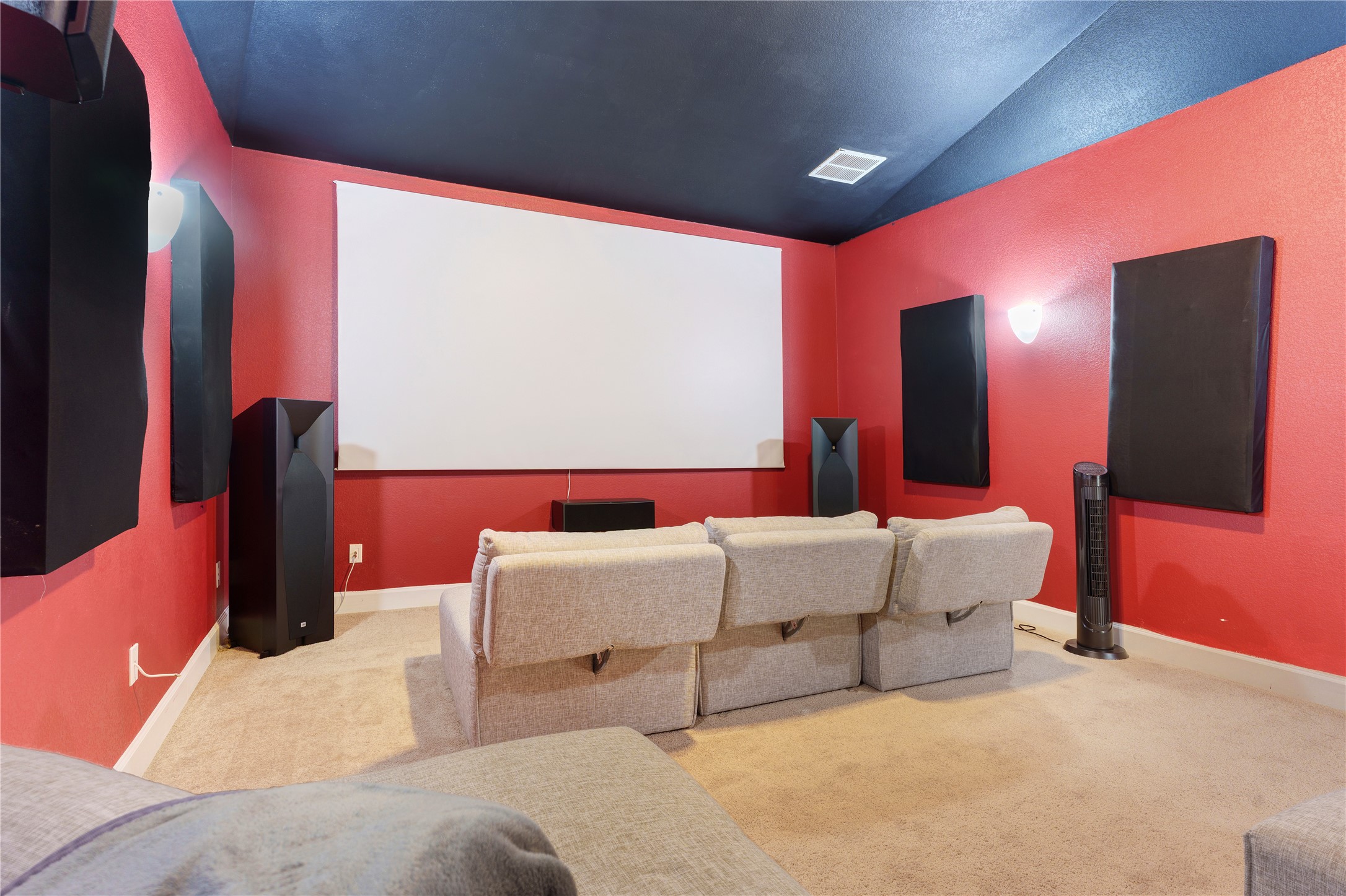 228 Lockhart Loop Georgetown, TX 78628 - Photo 25 of 37 Experience cinematic grandeur in this dedicated home theater, offering plush seating and a vast projection screen.