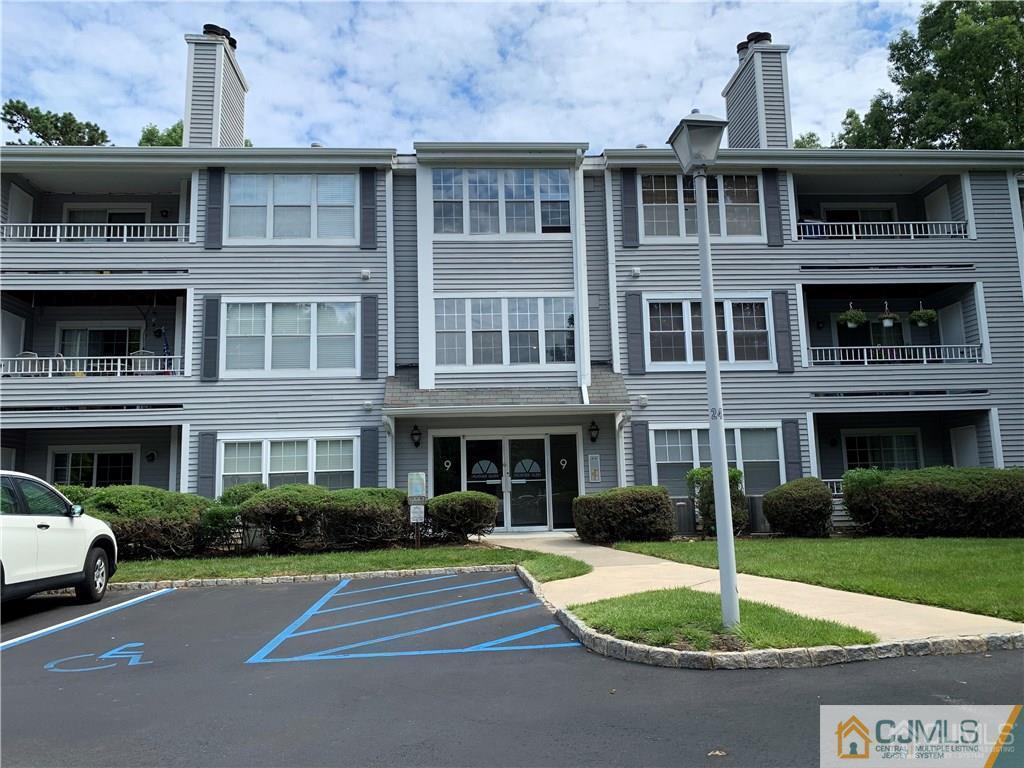 910 Meadow Court, Unit 910 Helmetta, NJ 08828 - Photo 1 of 43 a front view of a building with garden