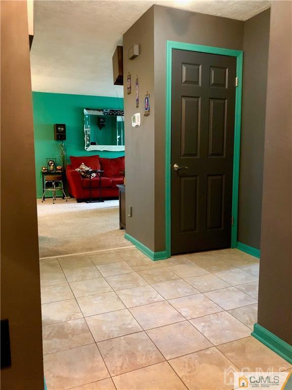 910 Meadow Court, Unit 910 Helmetta, NJ 08828 - Photo 18 of 43 a view of front door of a house