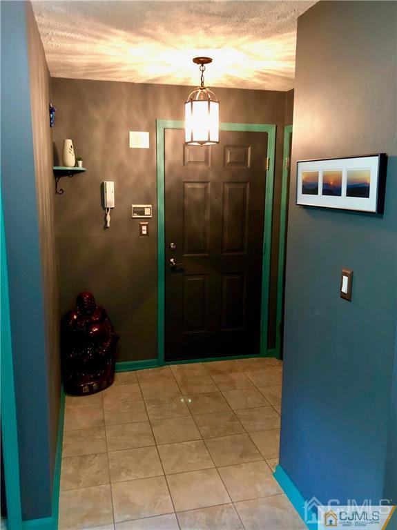 910 Meadow Court, Unit 910 Helmetta, NJ 08828 - Photo 25 of 43 a bathroom with a glass door shower