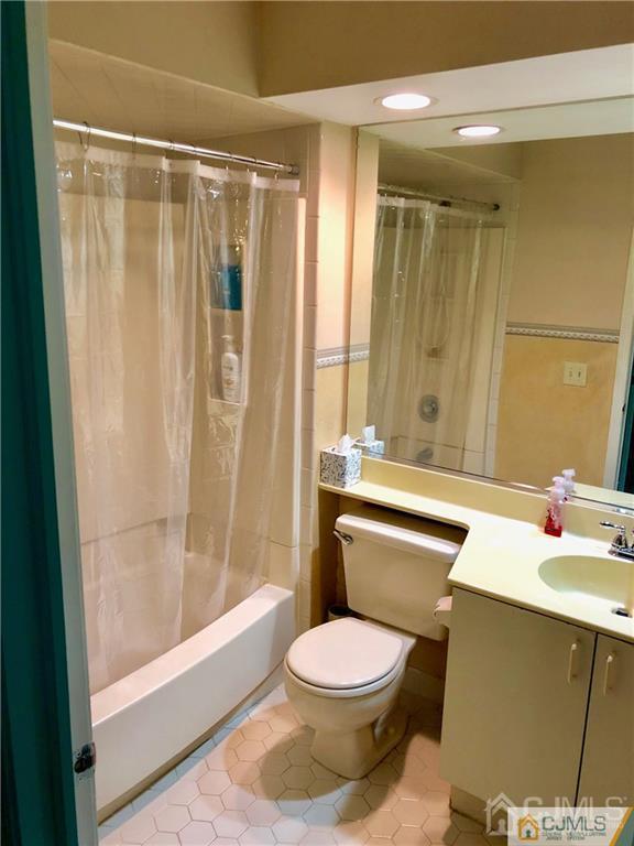 910 Meadow Court, Unit 910 Helmetta, NJ 08828 - Photo 33 of 43 a bathroom with a sink a toilet and shower