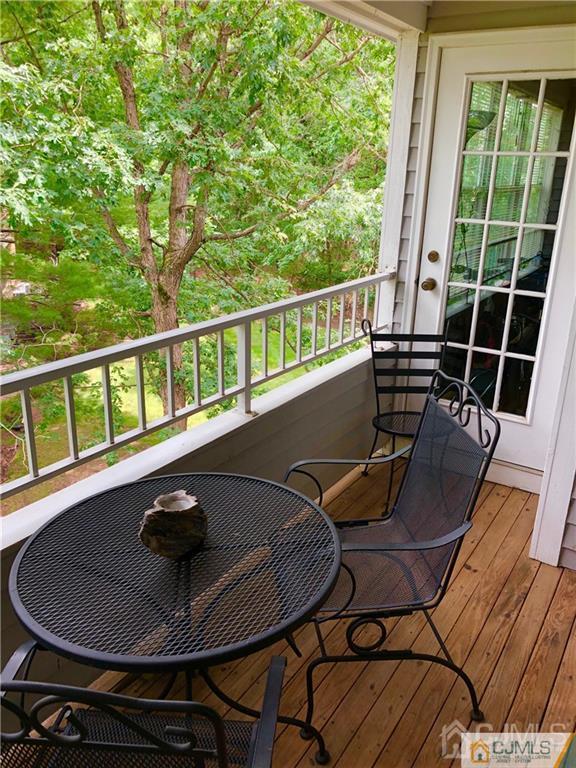 910 Meadow Court, Unit 910 Helmetta, NJ 08828 - Photo 4 of 43 a view of a balcony with chairs