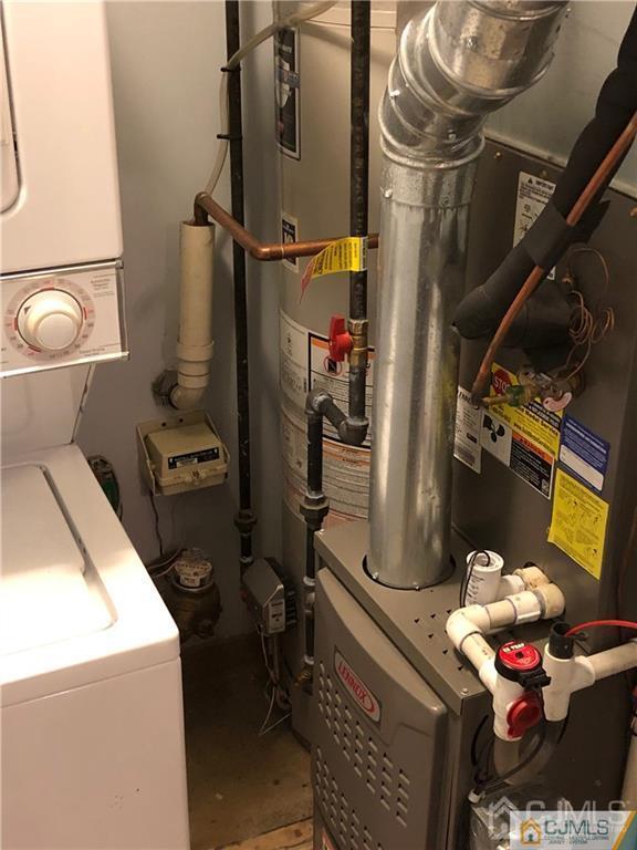 910 Meadow Court, Unit 910 Helmetta, NJ 08828 - Photo 41 of 43 a utility room with dryer washer and other items