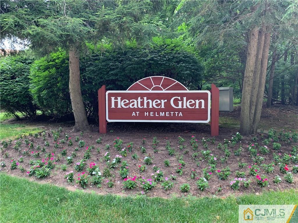 910 Meadow Court, Unit 910 Helmetta, NJ 08828 - Photo 43 of 43 a sign that is sitting on a rock