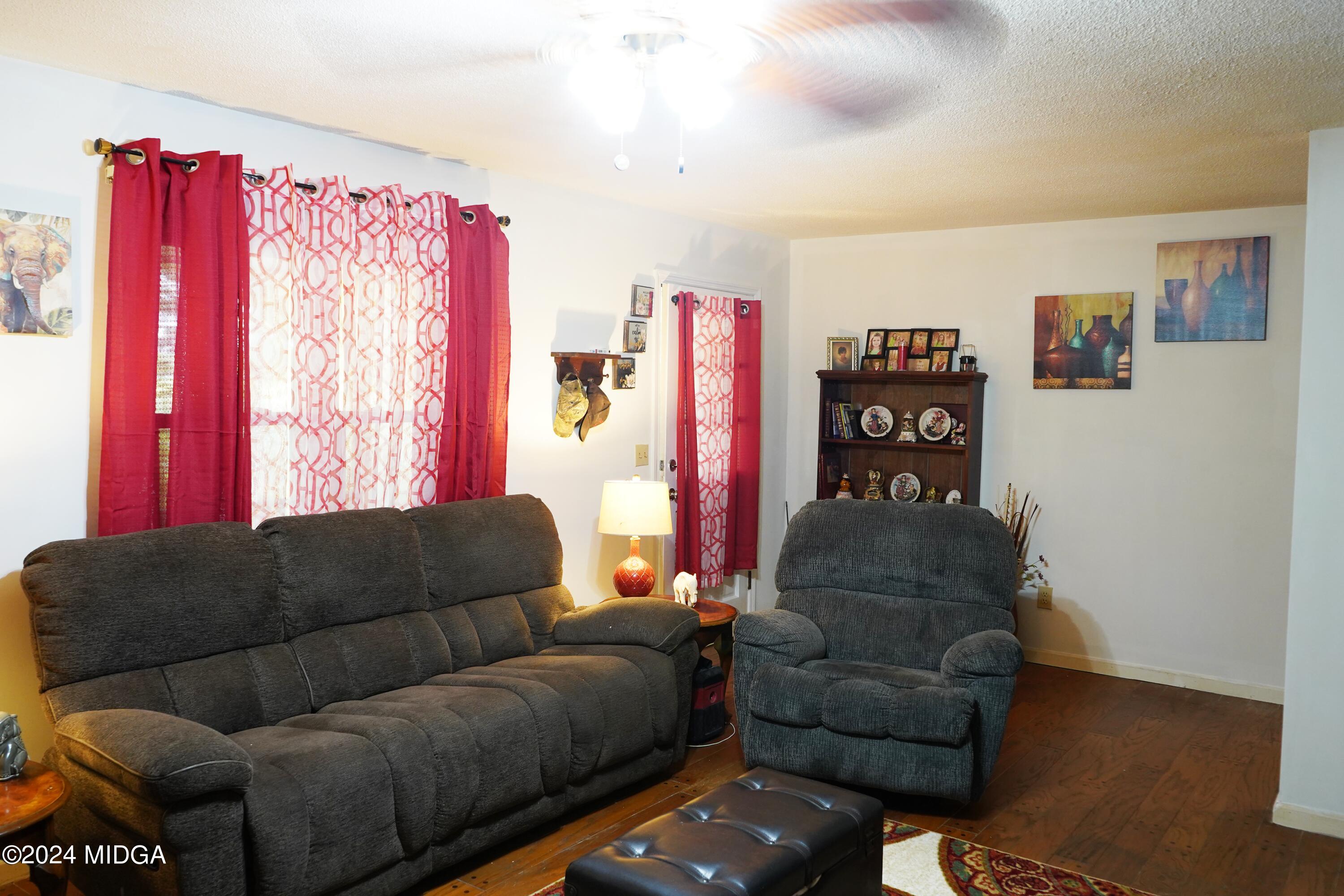 1082 Old Cabaniss Road Forsyth, GA 31029 - Photo 5 of 14 a living room with furniture and a couch
