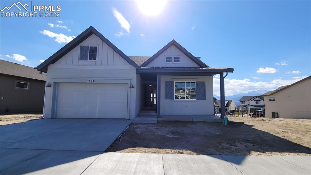 1131 Charismatic Way Colorado Springs, CO 80921 - Photo 1 of 24 a view of a house with door