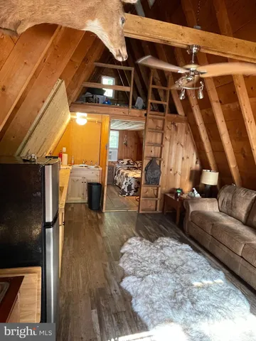 a view of living room with furniture and a rug