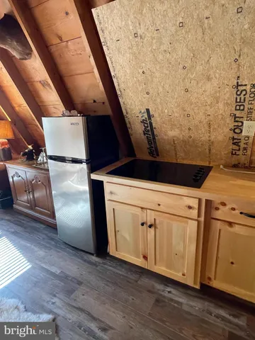 a view of a kitchen with wooden floor